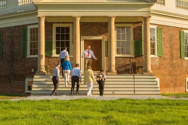 Visitors to Thomas Jefferson's Poplar Forest enjoy one of our historical tours on their way up the front stairs to enter the building.