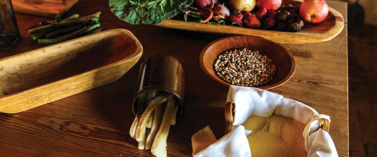 Produce and other cooking ingredients lay on a table in the kitchen of Thomas Jefferson's Poplar Forest.