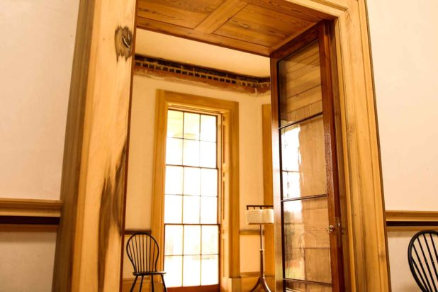 An interior doorway at Poplar Forest with freshly-restored wood trim surrounding the opening.